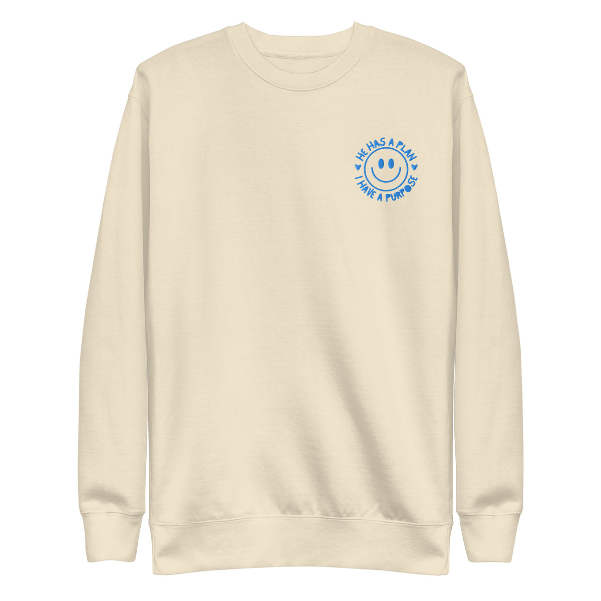 Beige sweatshirt with blue happyface graphic and text that reads He Has A Plan, I have a Purpose on a white background