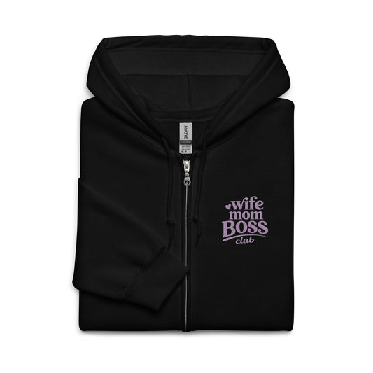 Folded black 
hoodie with 'Wife Mom Boss Club' embroidered  text in lavender on a white background